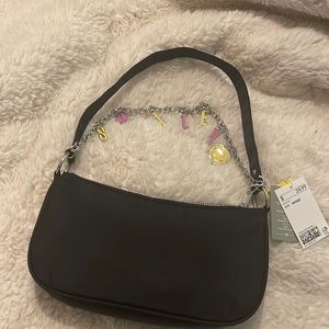 Small black handbag with silver chain detail
